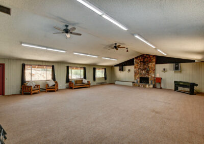 Meeting area with a fireplace in Pine Lodge