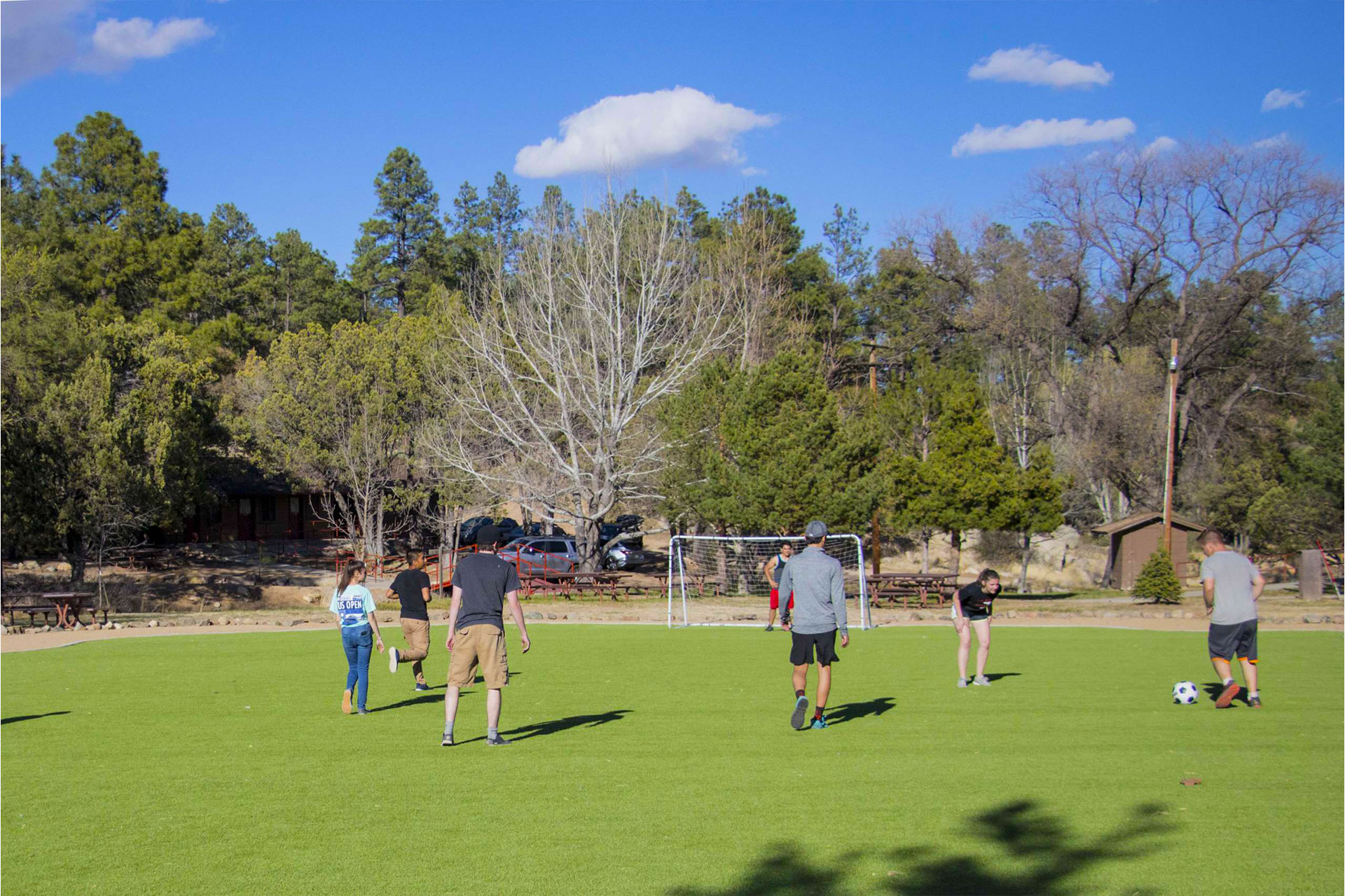 Guests playing soccer on the field